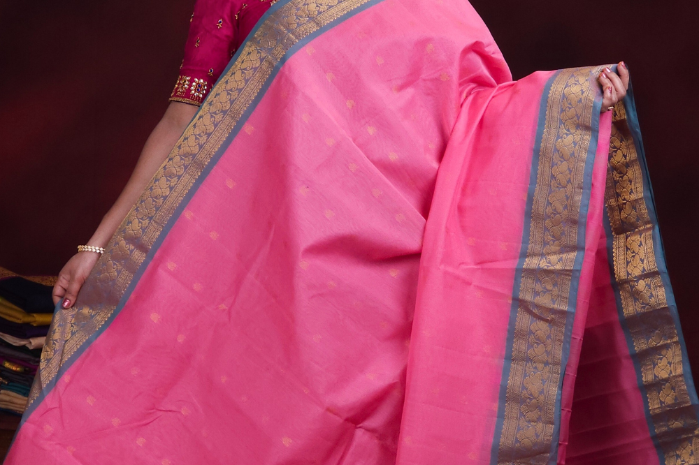 Close-up of zari motif detailing on baby pink handloom Gadwal saree