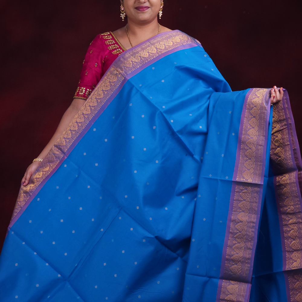 Close-up of zari motif detailing on copper sulphate blue Gadwal saree