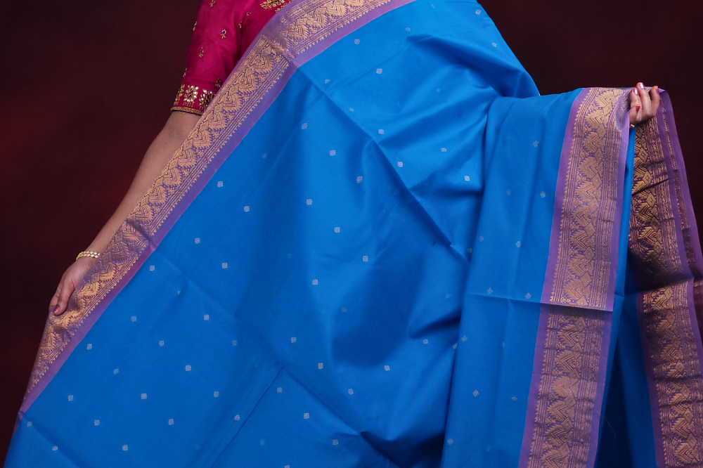 Close-up of zari motif detailing on copper sulphate blue Gadwal saree