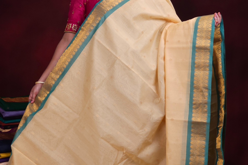 Close-up of zari motif detailing on cream Gadwal saree