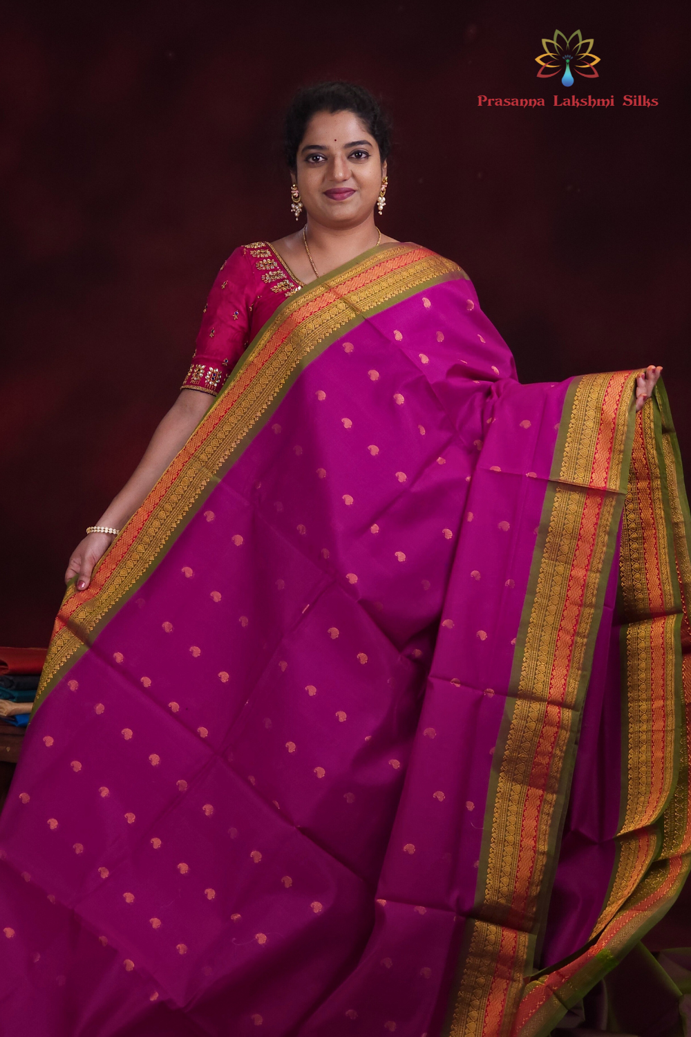 Close-up of zari motif detailing on deep magenta Gadwal saree