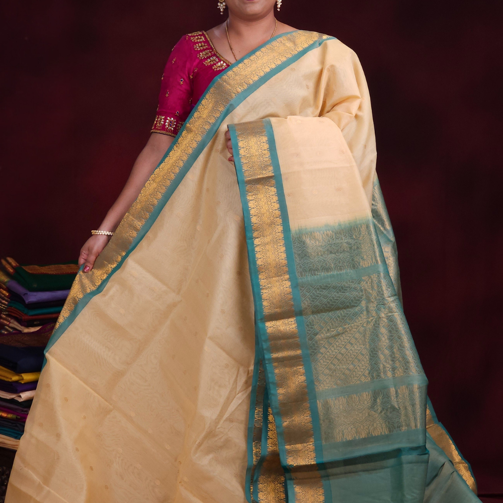 Cream Gadwal silk cotton saree with Light Sea Green zari-woven border