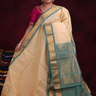 Cream Gadwal silk cotton saree with Light Sea Green zari-woven border