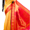 Handloom Gadwal silk cotton saree with all-over zari buttis and rich brocade pallu.

