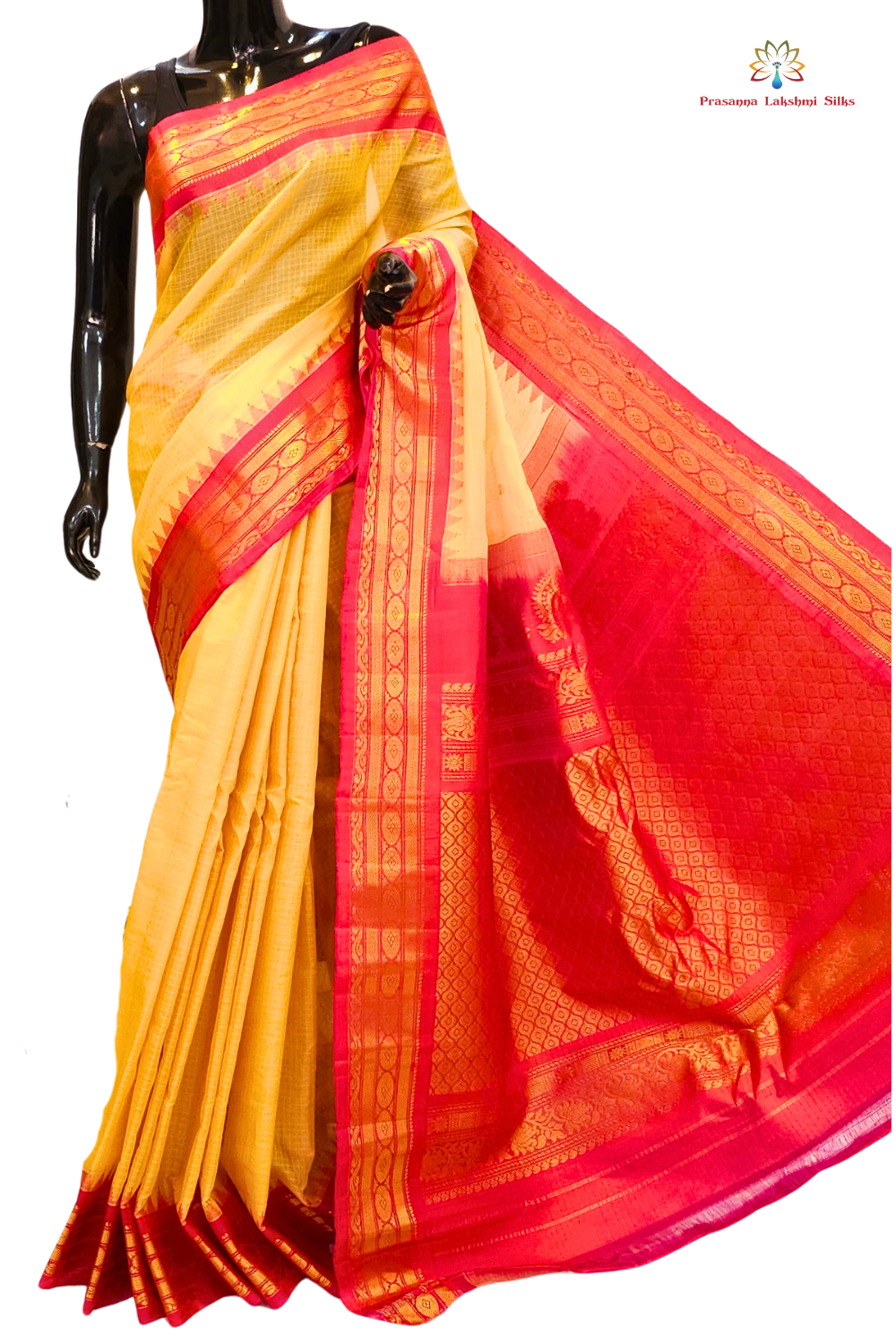 Handloom Gadwal silk cotton saree with all-over zari buttis and rich brocade pallu.

