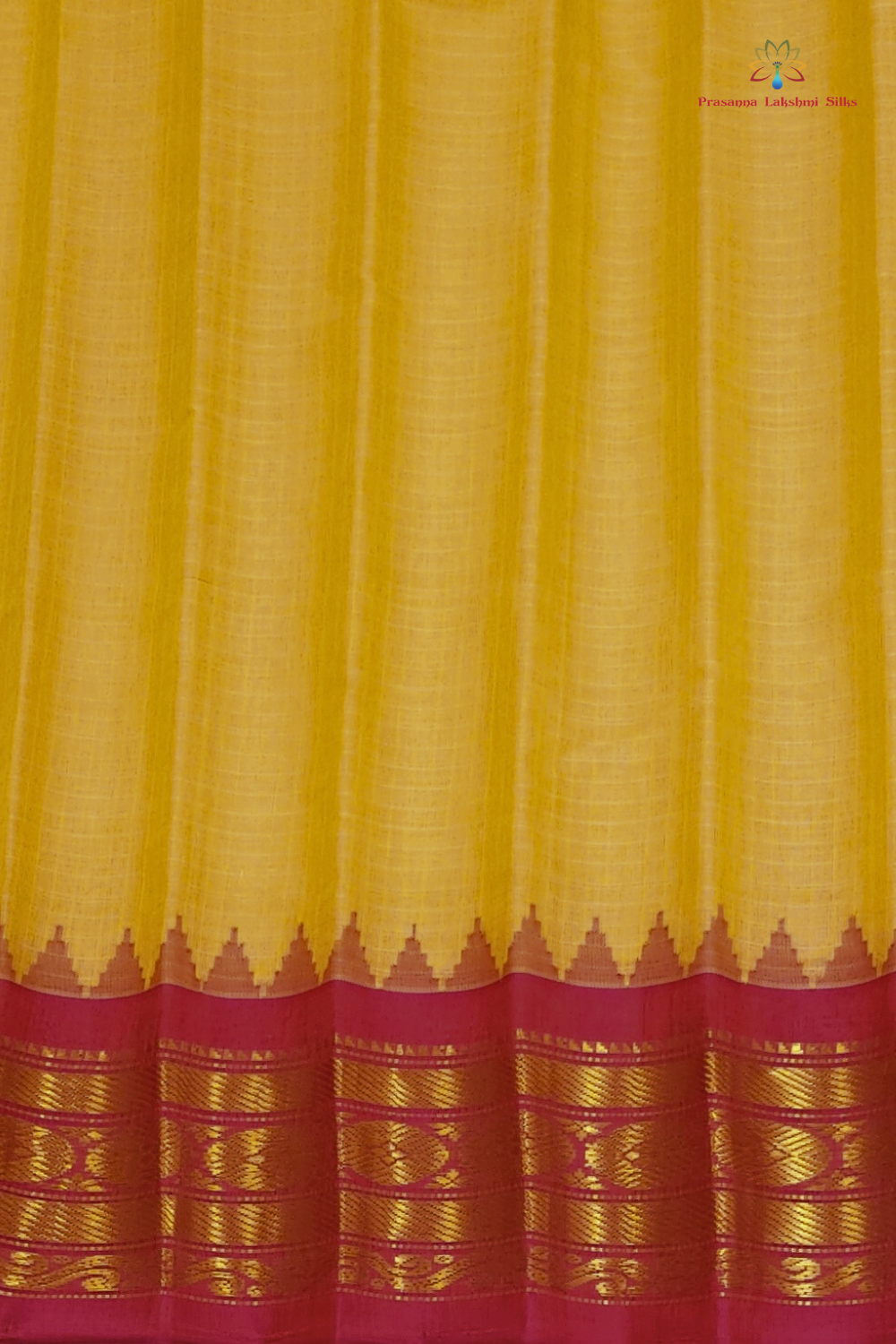 Cream and pink handloom Gadwal saree draped, showing blouse piece and zari detailing