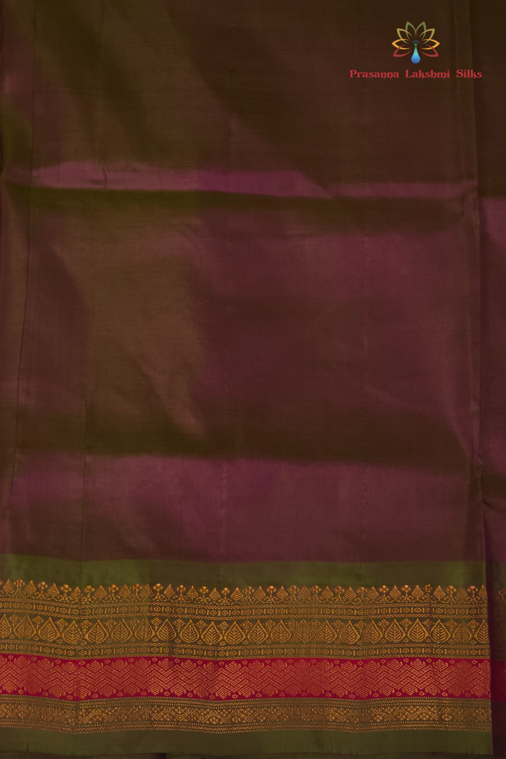 Deep magenta and olive green Gadwal saree draped, showing brocade pallu and olive green blouse