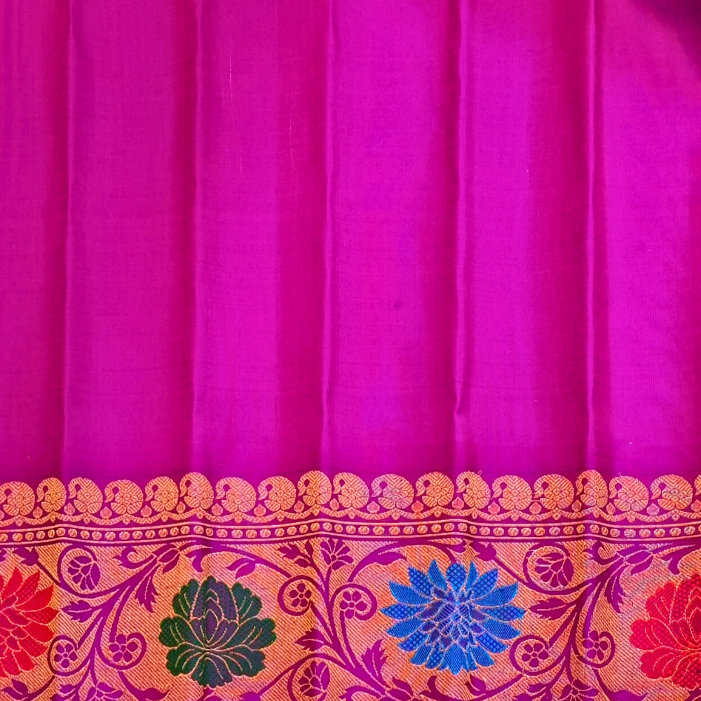 Elegant Telugu traditional Gadwal silk saree in dual shade green purple with matching purple blouse

