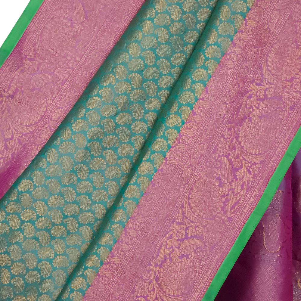 Elegant Telugu traditional Gadwal silk saree in mint green with lavender blouse piece

