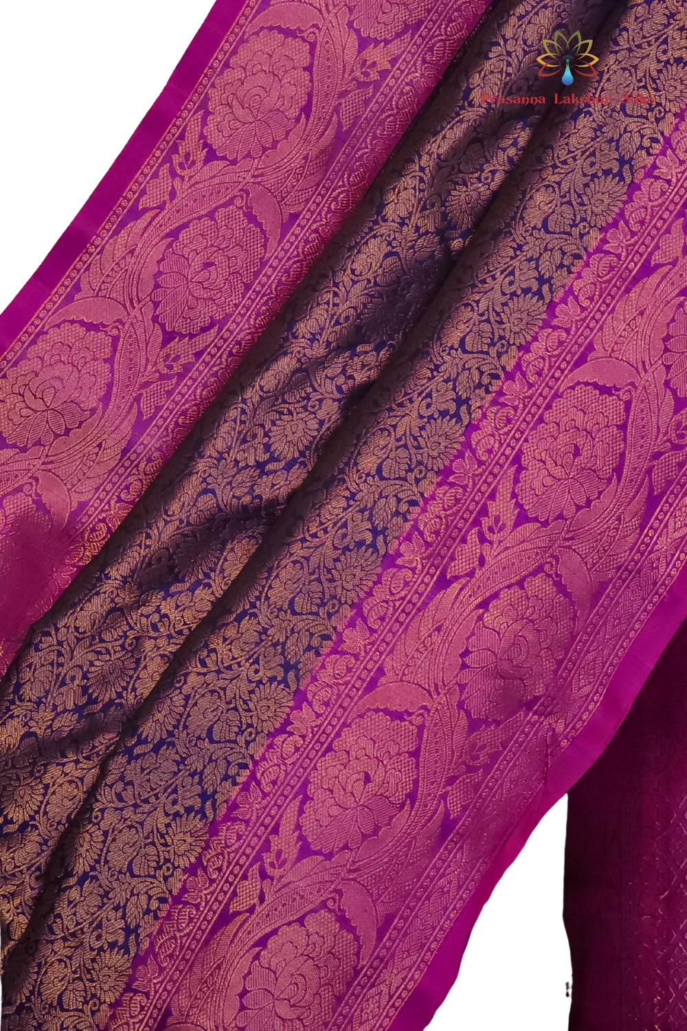 Elegant Telugu traditional Gadwal silk saree in navy blue with purple blouse piece

