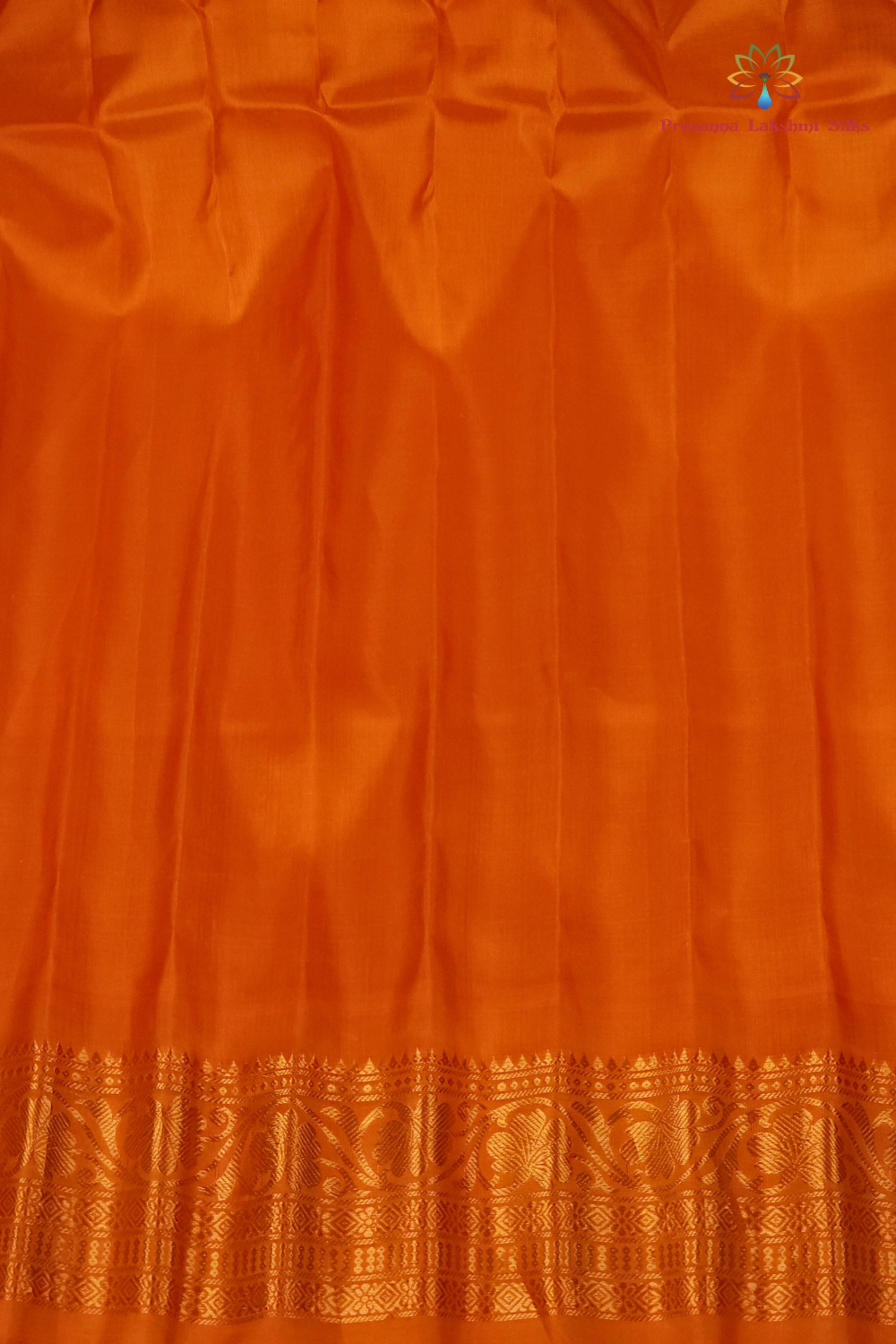 Elegant purple pure silk Gadwal saree with orange blouse piece from Prasanna Lakshmi Silks

