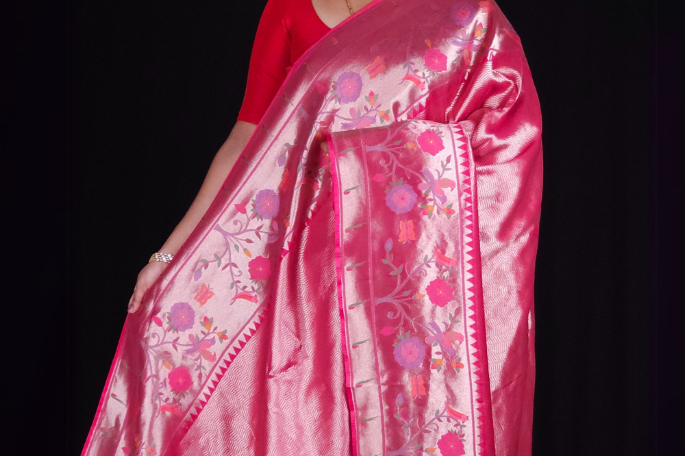 "Pink tissue saree with floral pallu and running blouse"