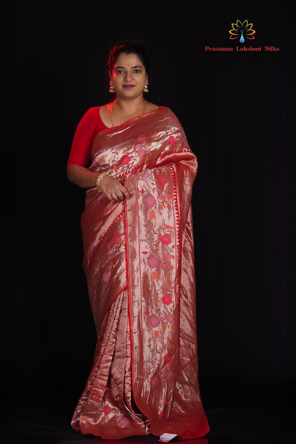 "Red tissue saree with floral pallu and running blouse"