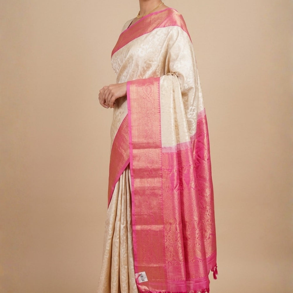 Half white pure handloom Gadwal silk saree with baby pink turning border and all-over gold zari brocade design