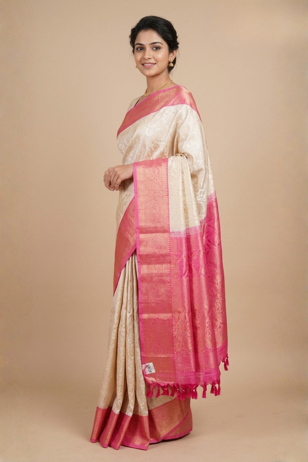 Half white pure handloom Gadwal silk saree with baby pink turning border and all-over gold zari brocade design