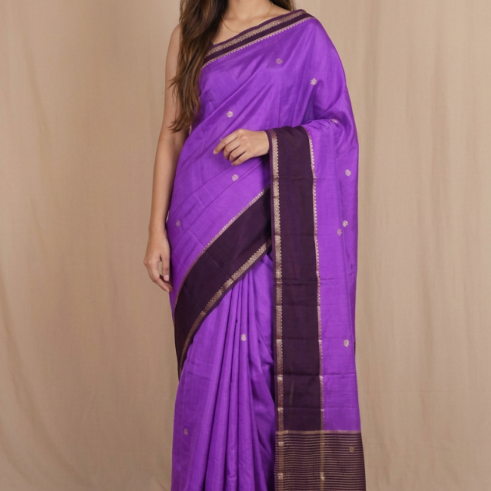 Banarasi Munga silk saree with all-over zari woven floral motifs and rich brocade pallu.
