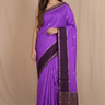 Banarasi Munga silk saree with all-over zari woven floral motifs and rich brocade pallu.
