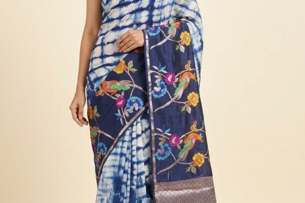 Banarasi organza saree with allover Shibori prints and floral meenakari zari woven border
