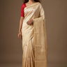 Elegant Munga Tissue festive saree with intricate zari brocade weaving and matching running blouse.
