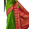 Handloom Gadwal silk cotton saree with all-over zari buttis and rich brocade pallu.
