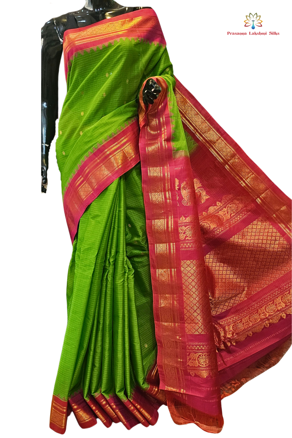 Handloom Gadwal silk cotton saree with all-over zari buttis and rich brocade pallu.
