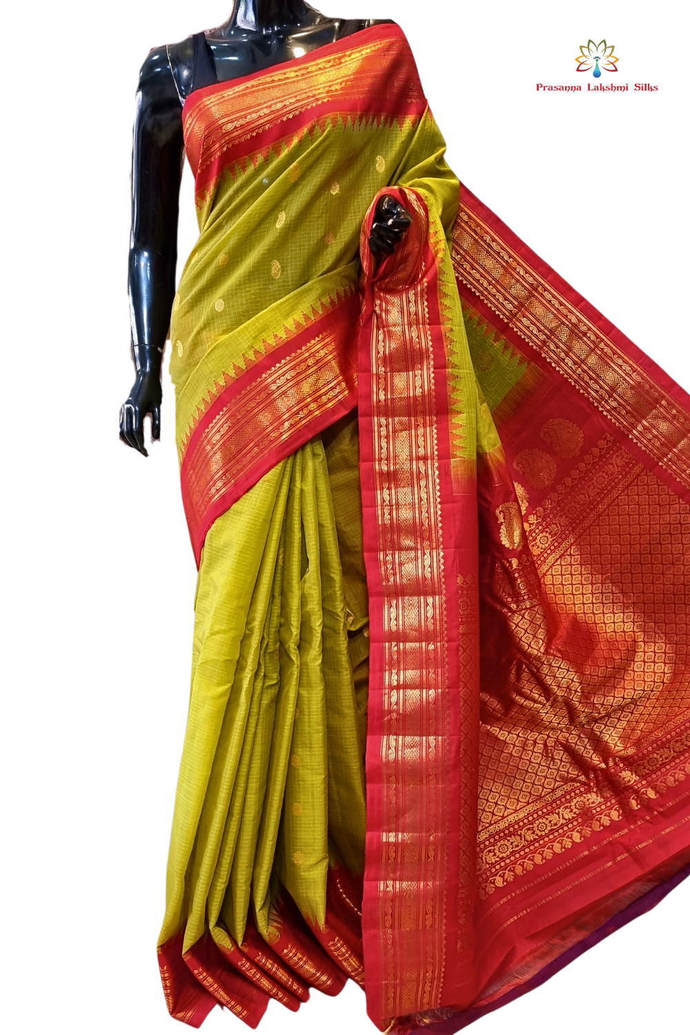 Handloom Gadwal silk cotton saree with all-over zari buttis and rich brocade pallu.
