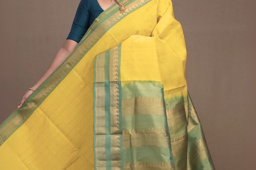 Lime yellow Gadwal silk cotton saree with green zari-woven border