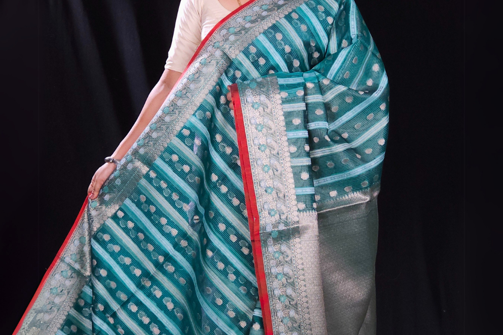 green fancy saree with zari borders