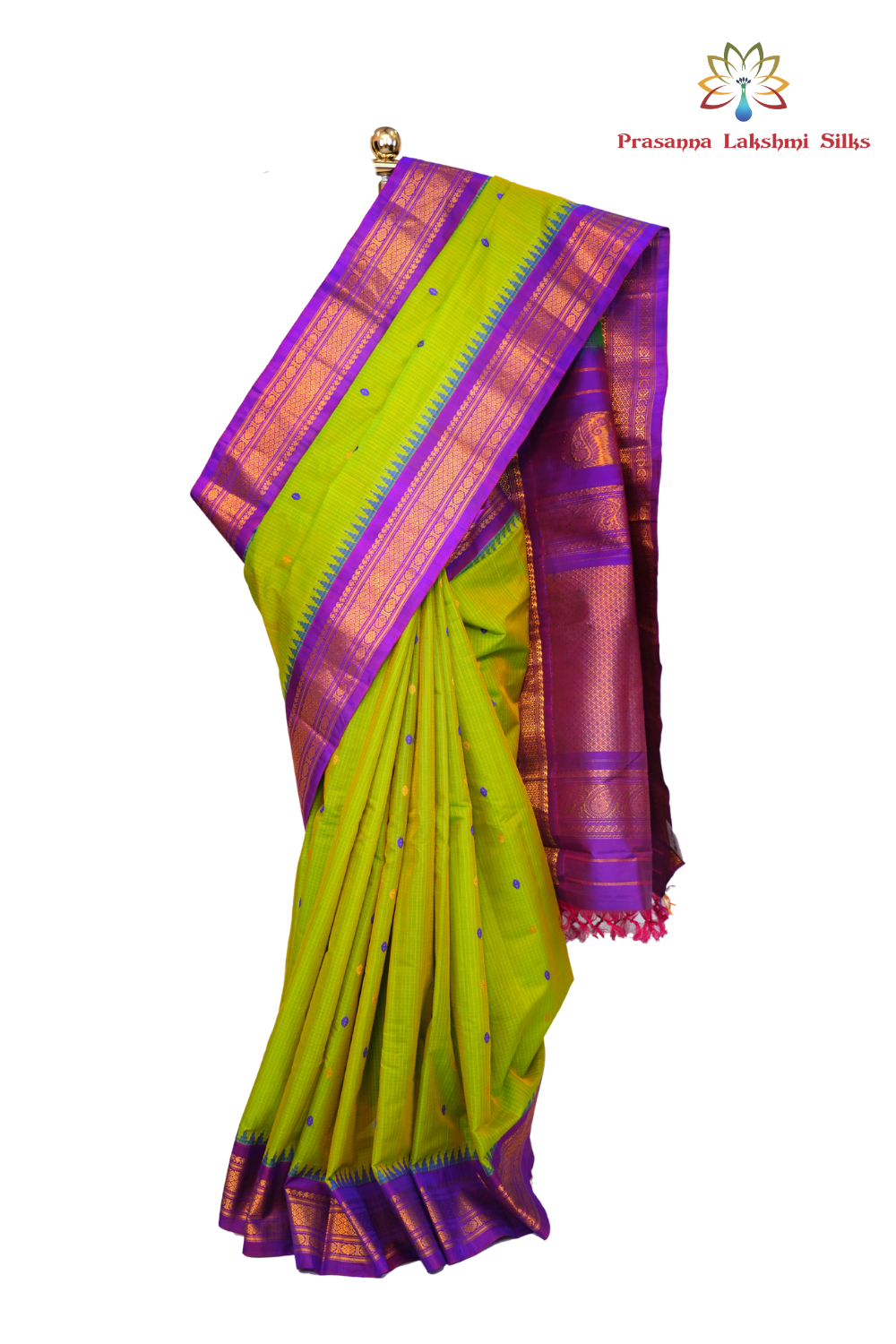Handloom Gadwal silk cotton saree with all-over zari buttis and rich brocade pallu.
