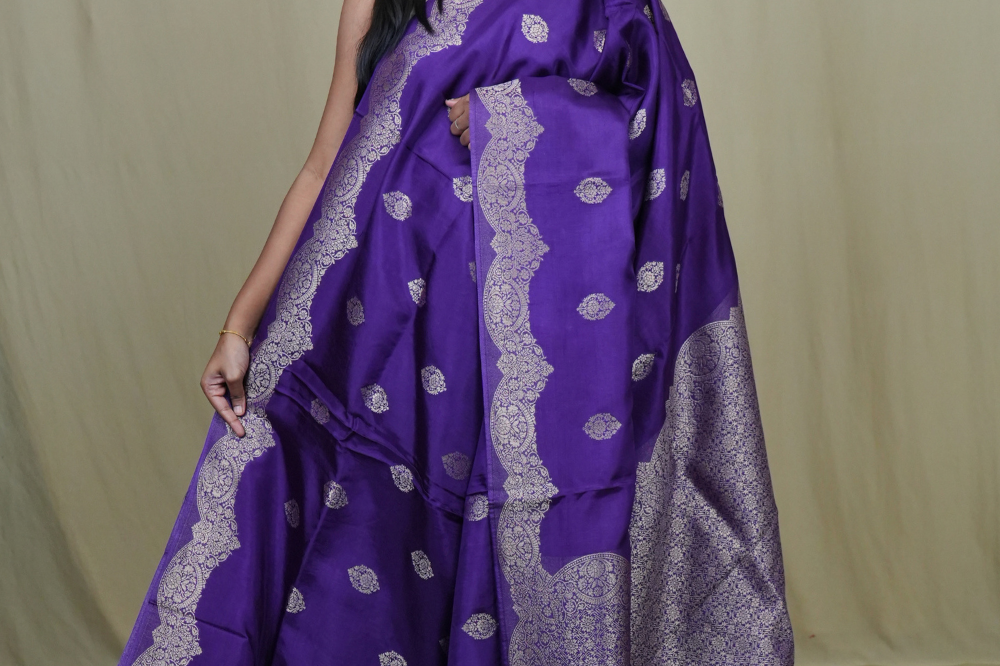 Banarasi Munga silk saree with all-over zari woven floral motifs and rich brocade pallu.
