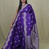 Banarasi Munga silk saree with all-over zari woven floral motifs and rich brocade pallu.

