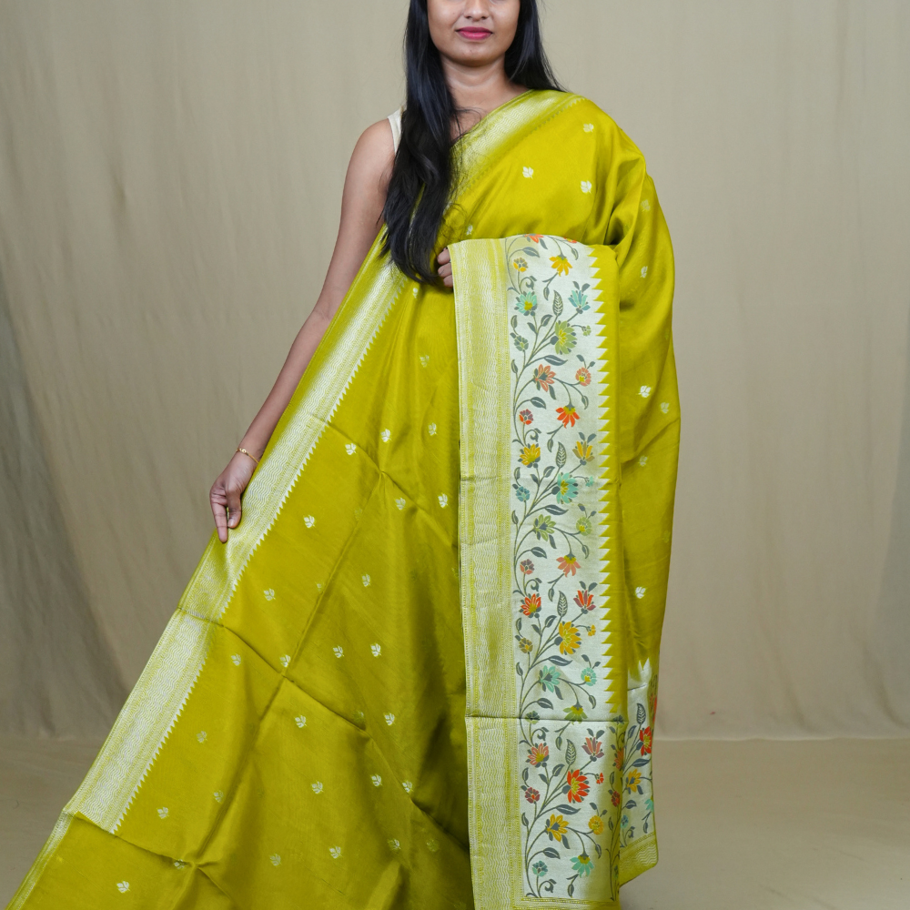 Tussar Georgette Saree with all-over silver zari woven motifs and floral Meenakari borders.
