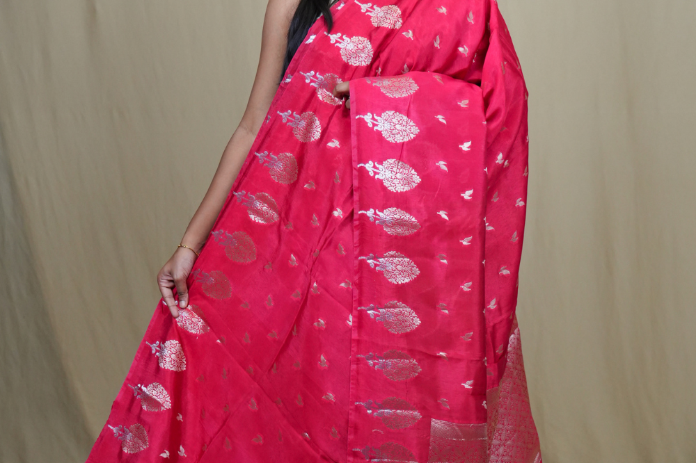 Banarasi Munga silk saree with all-over leaf-shaped zari woven motifs and gold/silver floral borders.
