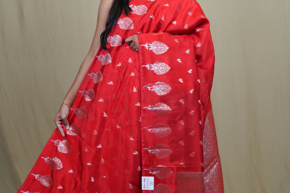 Banarasi Munga silk saree with all-over leaf-shaped zari woven motifs and gold/silver floral borders.
