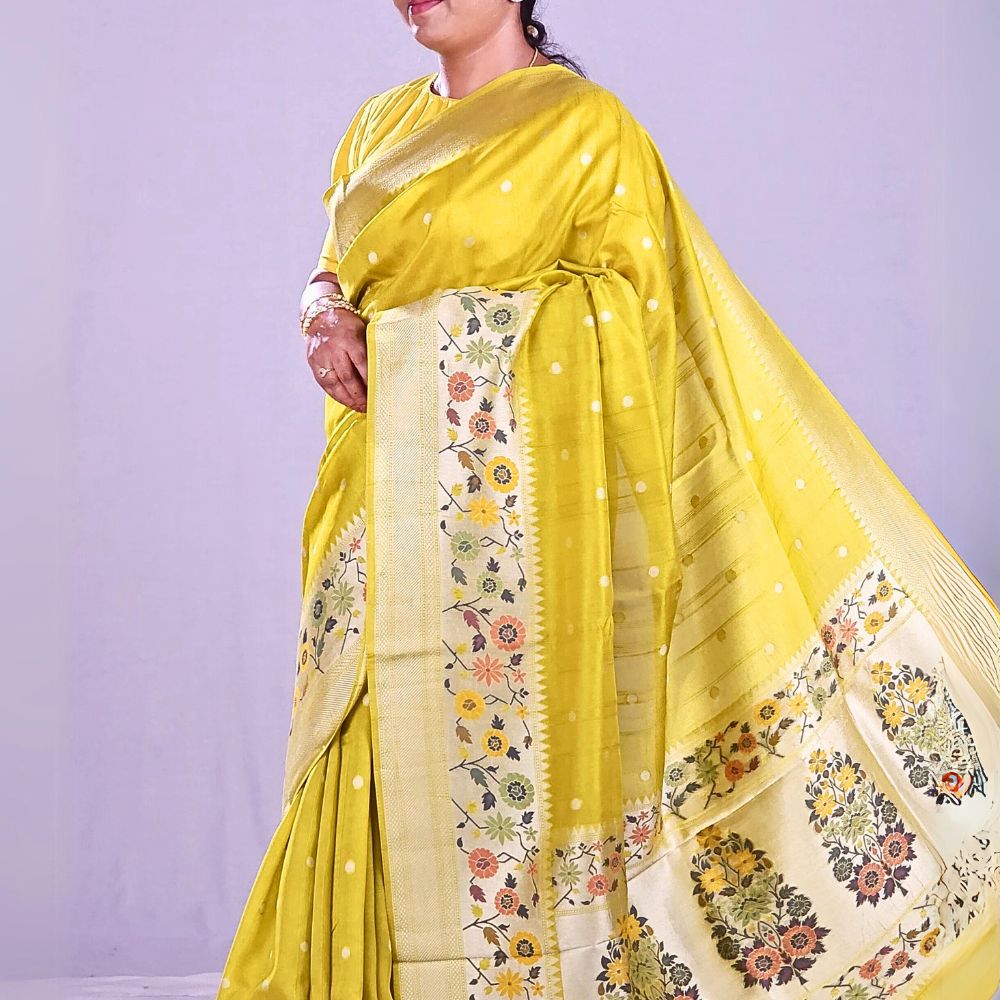 Lime Green"Banarasi Tussar Georgette saree with floral borders."