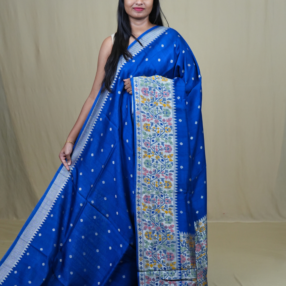 Tussar Georgette Saree with all-over silver zari woven motifs and floral Meenakari borders.
