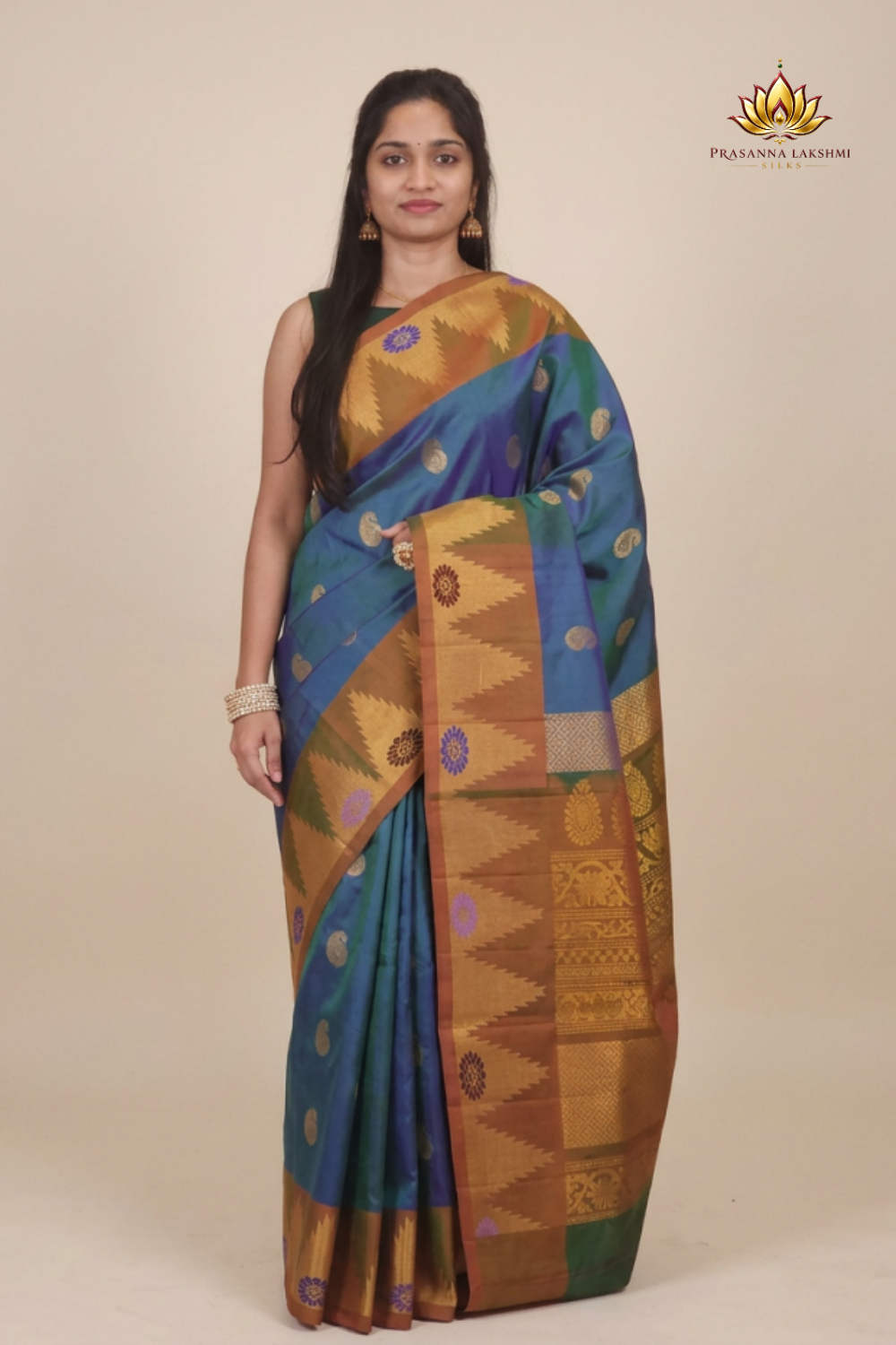 Gadwal Silk Saree featuring all-over zari motifs, intricate meenakari border, rich zari brocade pallu, and contrast blouse.
