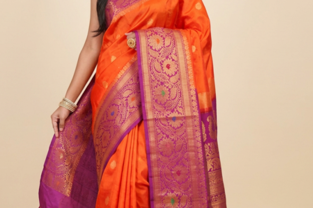 Gadwal Silk Saree featuring all-over zari motifs, intricate meenakari border, rich zari brocade pallu, and contrast blouse.
