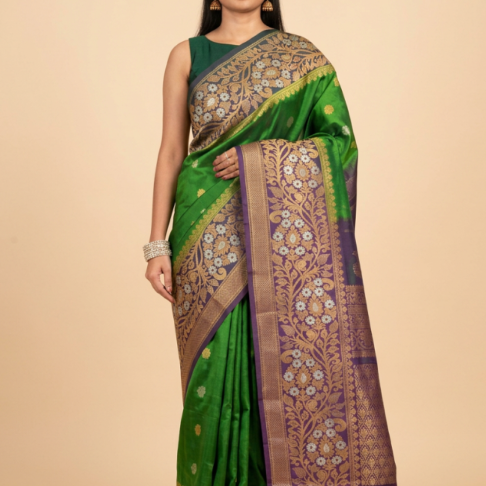 Gadwal Silk Saree featuring all-over zari motifs, intricate meenakari border, rich zari brocade pallu, and contrast blouse.
