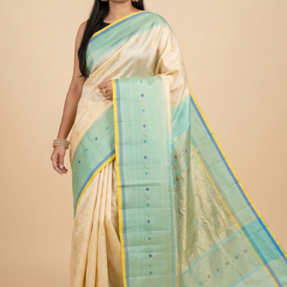 Gadwal Silk Saree featuring all-over zari motifs, intricate meenakari border, rich zari brocade pallu, and contrast blouse.
