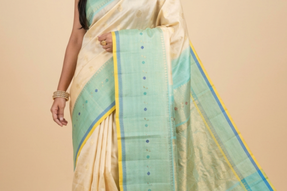 Gadwal Silk Saree featuring all-over zari motifs, intricate meenakari border, rich zari brocade pallu, and contrast blouse.
