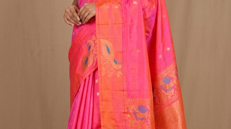 Pure handloom Gadwal silk saree with all-over zari motifs and intricate turning borders
