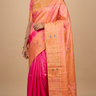 Pure handloom Gadwal silk saree with all-over zari motifs and intricate turning borders
