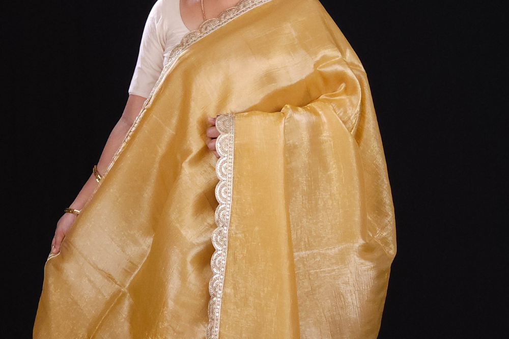cream Designer crush tissue saree with cutwork detailing