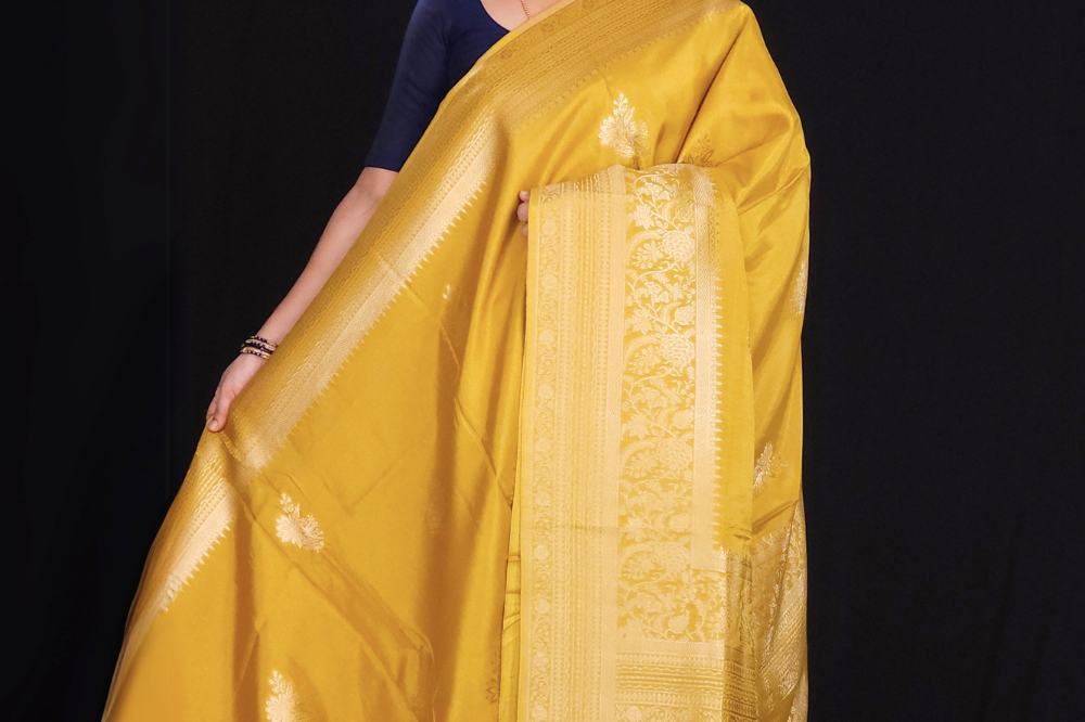 "Mustard Yellow Banaras saree with  gold Zari  border"

