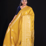 "Mustard Yellow Banaras saree with  gold Zari  border"

