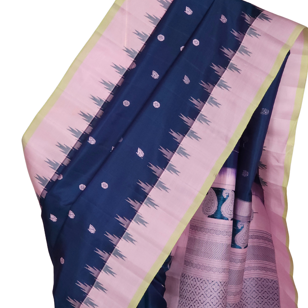 Peacock blue handloom Gadwal pure silk saree with lotus pink zari border and rich brocade pallu
