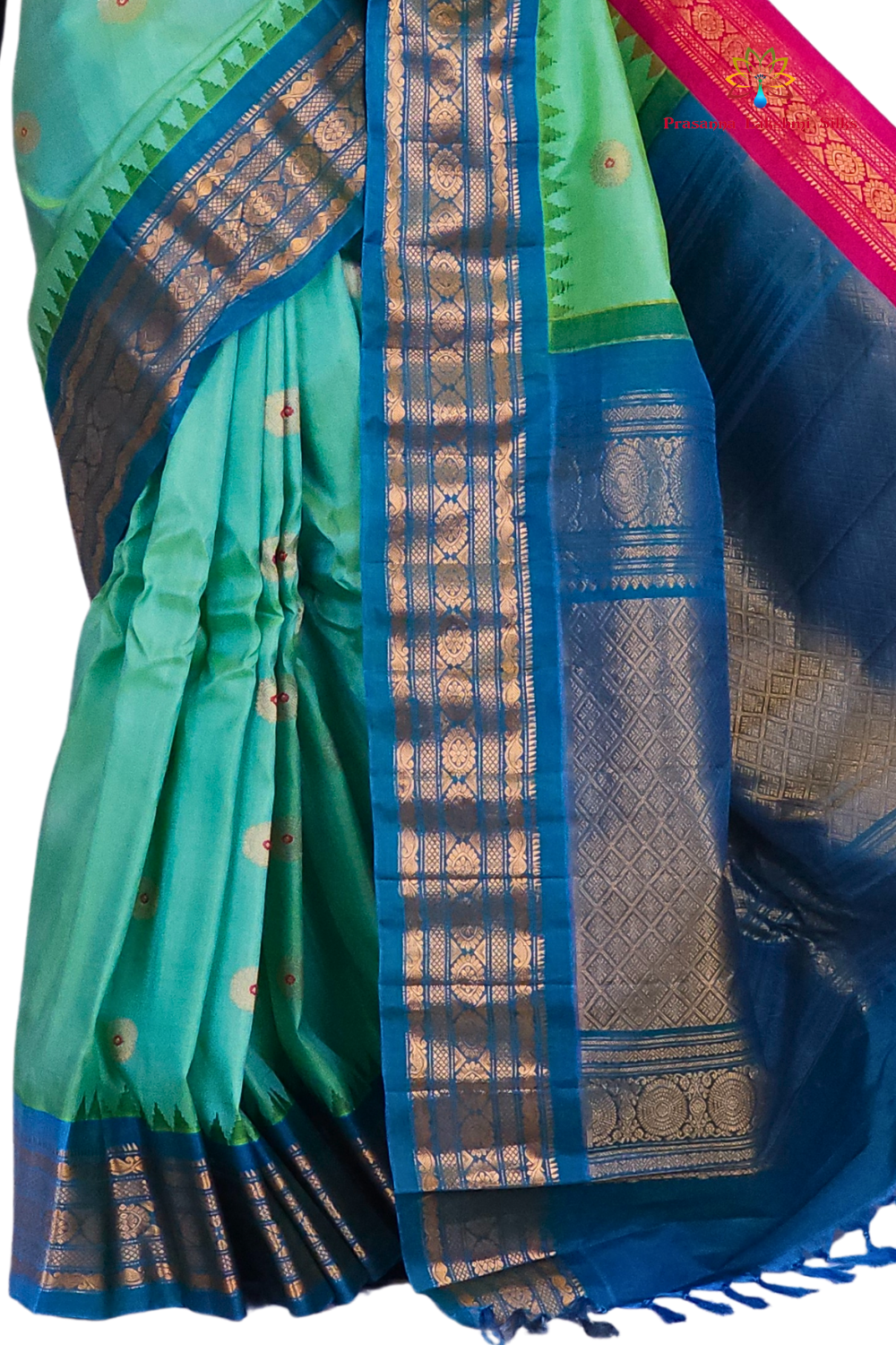 Premium Silk Mark certified sea green Gadwal saree paired with a matching teal blue blouse, showcasing the luxurious drape and dual-colored border design.