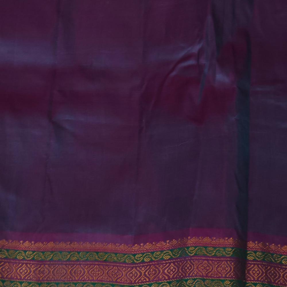 Rama Green Gadwal saree draped, showing brocade pallu and Dark Lilac blouse