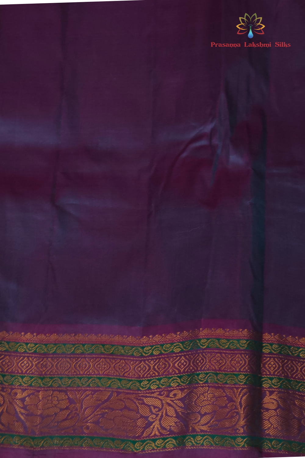 Rama Green Gadwal saree draped, showing brocade pallu and Dark Lilac blouse